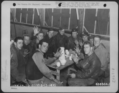 General > Ten Happy Flyers - Crew Members Of The 401St Bomb Group Boeing B-17 'Pee-Tey-Kuh' - Sit Around The Interrogation Table After Completing Their Fifth Bombing Mission (Target - Kiel, Germany) On 13 December 1943.  The Men Are S/Sgt. Herbert F. Williams, Flex