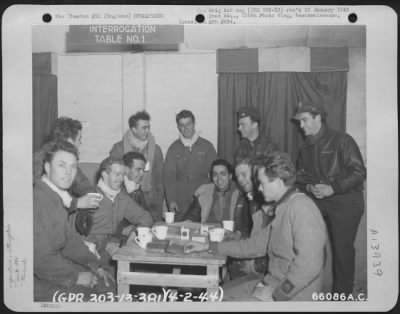 Thumbnail for General > Crew Members Of The 381St Bomb Group, Enjoy Refreshments As They Are Interrogated By Colonel Harry Leber.  8Th Air Force Station 167 In England, 4 February 1944.