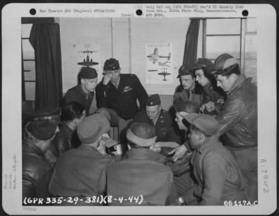 General > Brig. Gen. Auby C. Strickland, Colonel Harry Leber And Major Kidd, Of The 381St Bomb Group, Interrogating Crews After Mission Over Oldenburg, Germany.  England, 8 April 1944.
