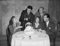 Robert Taylor Birthday with L-R Ann Dvorak, Taylor, Barbara Stanwyck, Jack Benny, Fred MacMurray.jpg