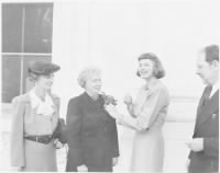 Photograph_of_First_Lady_Bess_Truman_receiving_a_community_chest_award_and_corsage_from_actress_Ingrid_Bergman,_who..._-_NARA_-_.jpg