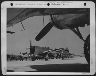 Republic > Framed by the wings and engine of its much larger friend, the B-17 ofrtress, this Republic P-47 Thunderbolt of the 8th Air force is shown "warming up" at the base depot in England where both ships have been modified for combat uponn arrival from