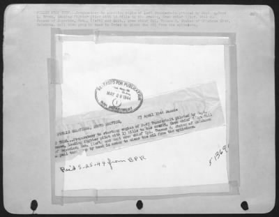 Republic > PULLIN PROP THRU . . . Preparatory to starting engine of P-47 Thunderbolt piloted by Capt. Qunice L. Brown, leading fighter pilot with 13 kills to his credit, Crew chief T/Sgt. Bill C. Jensen of Superior, Neb., (left) and Asst., crew chief Cpl.