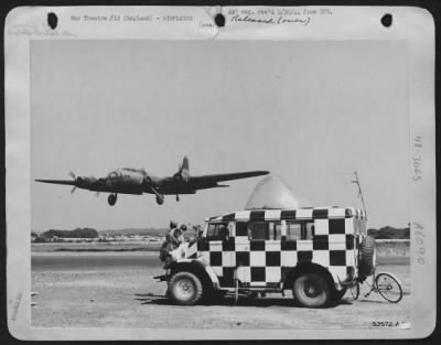 Boeing > Honorably retired from a career of combat, this Boeing B-17 is now in use as a personnel transport. Here it lands at a base depot in England, leaving a contingent of transport pilots. It is guided in by orders transmitted from the control tower