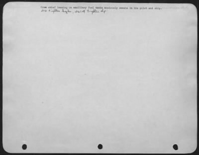 Thumbnail for Consolidated > Crew chief leaning on auxiliary fuel tanks anxiously sweats about his pilot and ship. 376 Fighter Squadron, 361st Fighter Group