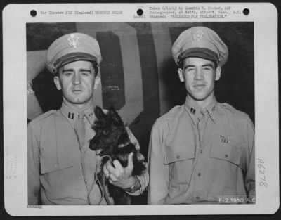 Thumbnail for General > Capt. James A. Verinis, 17 Prince St., New Haven, Conn., co-pilot of the Boeing B-17 Flying ofrtress "Memphis Belle" holding the crew's mascot, "Stuka", and Capt. Charles B. Leighton, 427 Haslett St., East Lansing, Mich.