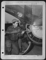 S/Sgt. Robert G. Vaughan, Carlton, Wash., is tired from the long trip to Frankofrt and is in a hurry to remove his guns from the turret and then join his crew at interrogation. ofllowing this, he can get that long-needed rest. - Page 1