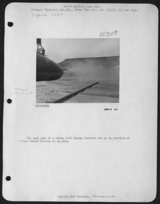 General > The tail guns of a Boeing B-17 Flying ofrtress let go in practice at a U.S. Bomber Station in England.