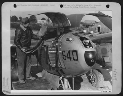 General > ENGLAND-The terrific fire-power of four 50 cal. Machine guns and a 20 MM cannon concentrated in nose of Lightning P-38 Lightning is one of the chief reasons for its success. Cpt. Joe Diez of Santa Barbara, Caliofrnia, checks the 20 MM ammunition