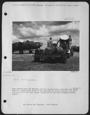 General > BOMB SERVICE TRUCK AND TRAILER, with two one-ton bombs, approaches the Flying ofrtress. Technically bombs of this size are not "block busters", but when one goes off it will kill anyone within 110 ft. and throw fragments nearly a mile.