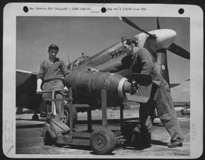 General > Cpl. Leroy Turner, of Altoona, Pa., (left and Sgt. Henry A. Bucko, of Hammond, Ind., are wheeling out on a bomb trailer a 500 lb bomb to be loaded on an 8th AAF P-51 Mustang "Yahootie Too" piloted by 1st Lt. John R. Bernert of Steubenville, C.