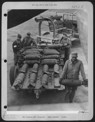 General > Bombs are being loaded in a Boeing B-17 Flying ofrtress to help the invasion army penetrate Hitler's ofrtress on the Second Front. The trailer carries the entire load of 100-pounders, the ofrtress "Chug-A-Lug IV" will drop, in one of the day's