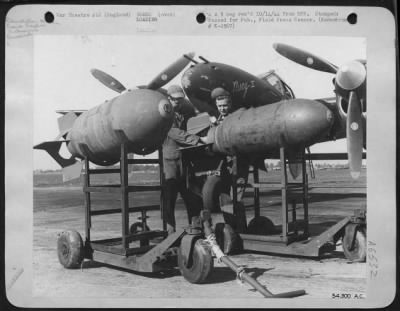 General > ENGLAND-Besides being used for strafing German installations and to escort 8th AF heavy bombers to strategic enemy targets and Lockheed P-38 Lightning fighter is also used for high altitude and dive bombing. Here two 1,000 pound demolition bombs