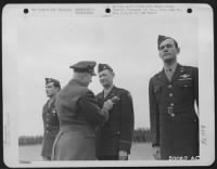 ESSEX, ENGLAND-Brig. General Robert C. Candee is in the procedure of pinning the Distinguished Flying Cross on Colonel Camuel E. Anderson. - Page 5