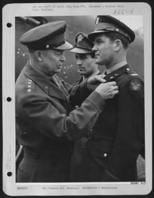 Awards > England-General Dwight D. Eisenhower, Supreme Allied Commander of the Invasion forces, presents the Distinguished Service Cross, second highest U.S. Award, to Colonel Donald J.M. Blakeslee, Commanding Officer of ETO's highest scoring fighter