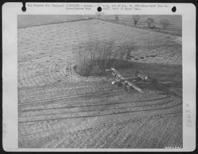 Consolidated > In A Field Near Watton, Norfolk, England, Where It Was Forced Down On The Return Trip From A Mission Over Enemy Territory, This Consoldiated B-24 Liberator Waits For The Return Trip To Its Home Base.  14 December 1943.  392Bg - D
