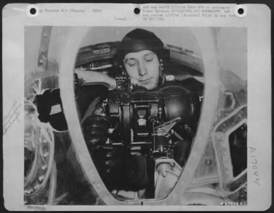 Bombardier > Maj. Wm. E. Smith 485 Central Ave., Hapeville, Ga. is seen with the Norden bombsight with which he has accurately dropped 4,000 tons of bombs on enemy targets in France, Belgium, Holland, and Germany. Maj. Smith, bombardier of a U.S. Army 9th Air