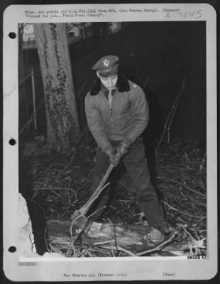 Bombardier > Capt. William E. Smith, (now Maj.), 485 Central Ave., Hapeville, Ga., the best bombardier in the 9th AF, keeps in physical trim by chopping wood, which incidentally provides fuel for his tent stove. Capt. Smith has served as lead bombardier of his