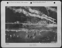 BEACHHEAD LANDINGS. Men and assault vehicles storm the beaches of Normandy as Allied Landing craft make a dent in Germany's West Wall on 6 June 44. As wave after wave of landing craft unload their cargo, men move forward and vehicles surge - Page 2
