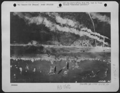 General > BEACHHEAD LANDINGS. Men and assault vehicles storm the beaches of Normandy as Allied Landing craft make a dent in Germany's West Wall on 6 June 44. As wave after wave of landing craft unload their cargo, men move forward and vehicles surge