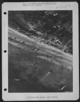 HEAVY TRAFFIC ON THE INVASION BEACHES  . . . This is how the beaches of Normandy looked on D-Day from one of the 9th AF Marauder medium bombers which went out in close support of Allied ground troops. Bombing from lower-than usual altitudes - Page 1