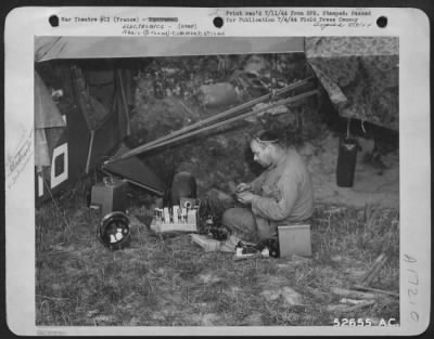 Radio > Photographed by a 9th AF Combat Cameraman, Sgt. William N. Stehle of Perry, Mo., a radio repair man for the artillery, works on the radio from one of the small planes used in spotting targets and fire effectiveness for the ground forces.