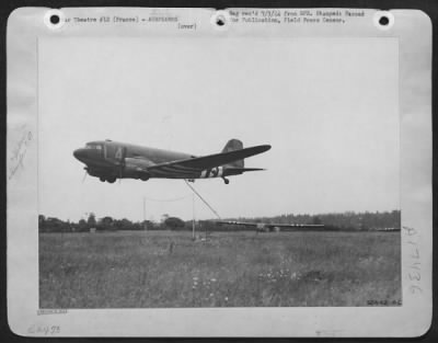 General > In a flower covered field in France a CG-4 Glider stood ready for the first snap take-off since D-Day on foreign territory. The take-off was successful under the supervision of Col. Glynne M. Jones, of 9th Troop Carrier Command.
