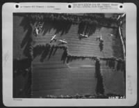 Pictured in the vast patchwork of fields in northern France gliders of the 9th AF Troop Carrier Command are shown after they had transported members of the airborne infantry to begin the initial assault for the liberation of Europe. - Page 1