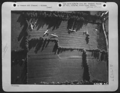 General > Pictured in the vast patchwork of fields in northern France gliders of the 9th AF Troop Carrier Command are shown after they had transported members of the airborne infantry to begin the initial assault for the liberation of Europe.