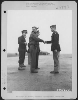 Unidentified > Major General Hoyt S. Vandenberg Congratulates A Member Of The 386Th Bomb Group After Presenting Him An Award During A Ceremony At An Air Base Somewhere In France.  23 October 1944.