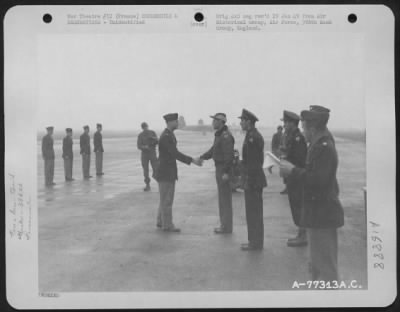 Unidentified > Major General Hoyt S. Vandenberg Congratulates A Member Of The 386Th Bomb Group After Presenting Him An Award During A Ceremony At An Air Base Somewhere In France.  23 October 1944.