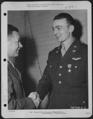 Unidentified > Major General Samuel E. Anderson Congratulates An Officer Of The 410Th Bomb Group After Presenting Him The Silver Star During A Ceremony At An Airbase Somewhere In France.