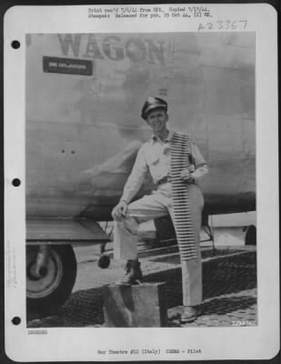 Consolidated > 2nd Lt. Garland H. Jarvis, Sissonville, W.Va., pilot of the Consolidated B-24 Liberator "WOLF WAGON II" when it ran into a thunderhead Wednesday, rests one foot on the tool box (weight 70 lbs) that floated around "like a balloon" when the bomber did