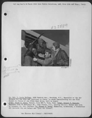 Consolidated > Lt. Col. I. Louis Hoffman, 2328 Newkirk Ave., Brooklyn, N.Y., Executive to the Air Surgeon for the 15th AAF stationed in Italy, is shown demonstrating his new Flak Helmet to fliers of the 376th Bomb Group. Left to Right: S/Sgt. Ralph W. Craul, Gunner