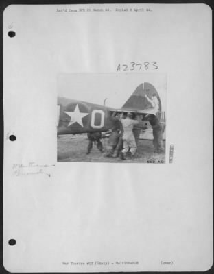 Consolidated > Manpower is the tool used most commonly by members of an air force service squadron on the beachhead south of Rome. Shown lifting the tail of a plane under repair are (left to right) S/Sgt. Stan F. Jackson, 215 Stebbins Pl. Plainfield, N.J.; S/Sgt.