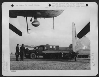 Consolidated > Specially trained air evacuation units of the 9th US Air Force are shown loading a Troop Carrier transport preparatory to moving soldier patients to a general hospital several hundred miles distant. February 1944.