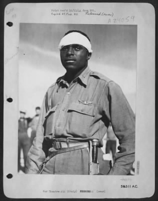 Consolidated > ITALY-Lt. Andrew D. Marshall, pilot in a Negro Fighter Group of the Mediterranean Allied Air Forces had his plane shot up by flak during a strafing mission over Greece before the Allied invasion. When he came down all that was left of the plane was