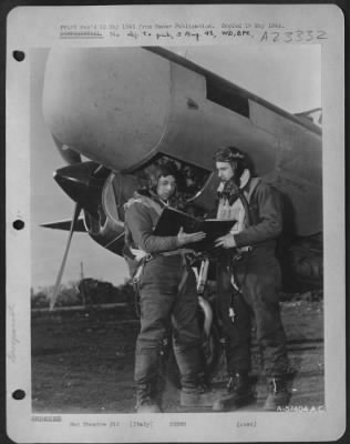 Thumbnail for Consolidated > Italy - Flight Plan Is Checked Carefully By Pilot And Mickey Operator Of Lockheed P-38 'Droopsnoot' Just Prior To Take Off.