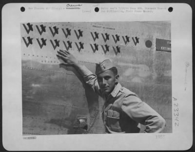 Thumbnail for Consolidated > Lt. Cecil V Henderson Of Stockton, Calif., A Bombardier In A Consolidated B-24 Liberator Group Of The 15Th Aaf In Italy, Is Proud Of His Successful Bomb Strikes And Chalks Them Up To His Plane As A Victory Sign, Double Checked With A Miniature Bomb.