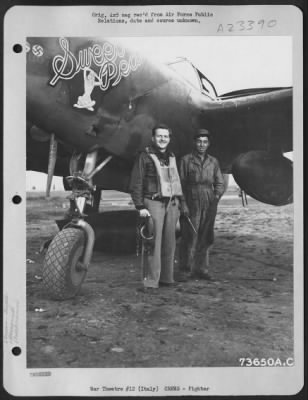 Consolidated > Capt. John S. Litchfield, Aurora, Nc, Pilot, And His Crew Chief, T/Sgt. Robert Elkins, Los Angeles, Calif., Pose Beside Their Lockheed P-38 Lightning 'Sweet Pea' At An Air Base In Italy.