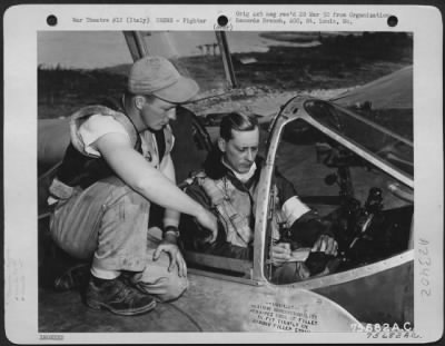 Consolidated > Before Taking Off On A Mission Pilot Of The 94Th Fs, 1St Fg, Makes A Last Minute Check With His Crew Chief At An Airfield Somewhere In Italy.