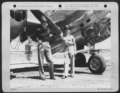 Thumbnail for Consolidated > Two Pilots Of The 94Th Fighter Squadron, 1St Fighter Group, Stand Beside A Lockheed P-38 Lightning At An Air Base Somewhere In Italy.  21 September 1945.