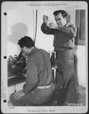 Consolidated > Laboratory Technicians Of The 94Th Fighter Squadron, 1St Fighter Group, Make Analysis Test At An Airfield Somewhere In Italy.