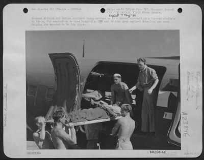 Thumbnail for Consolidated > Wounded British And Indian Soldiers Being Carried On To A Dakota Aircraft At A Forward Airfield In Italy, For Evacuation To Base Hospitals.  Raf And British Army Medical Orderlies Are Seen Helping The Wounded Onto The Plane.