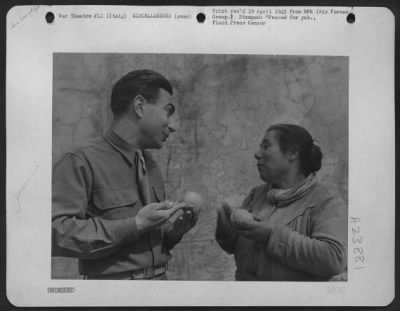 Consolidated > Sgt. Eddie Cope Of Austin, Texas Tries Out Sign Language On An Italian Fruit Peddler.  He Buys An Orange - But It Costs Him Double!  Italy.