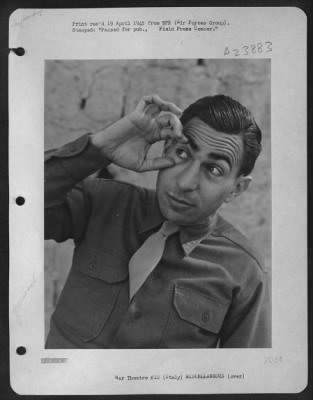 Consolidated > Sgt. Eddie Cope Of Austin Texas Illustrates The Sign Language Enabling American G.I.'S In Italy To Carry On Long And Involved Conversation With The Local Talent.  'Open Your Eyes' - Thumb And Forefinger Pry Open The Right Eye In A Gesture Of Mild Sarcasm.