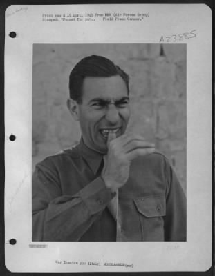Consolidated > Sgt. Eddie Cope Of Austin, Texas Illustrates Sign Language Used By American Gi'S In Italy.  'Oh, Fie On You!' - The Thumb Is Flicked From Beneath Upper Incisors.  Note: This Gesture Is Not Recommended For Those With False Teeth.