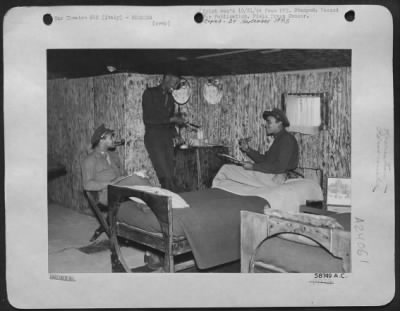 Thumbnail for Consolidated > Italy - Inside Their Cozy Abode Which Boasts Hot And Cold Runnign Water, Sink, Poker Table, And Service Bar Are: Left To Right, Maj. Elmer D. Jones, Jr., Washington, D.C.; 1St Lt. Omar D. Blair, Los Angeles, Ca; And 1St Lt. John Hansen Williams, Los Angel