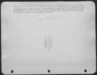 Consolidated > Busy At The Ticklish Job Of Removing An Aircraft Engine From The Engine Seat In The Wing, Are Three Aircraft Mechanics Of The All-Negro Service Group.  L. To R. Are, Sgt. Bonnie D'Garden, Of 270 Hudson, St., Jackson, Misissippi; Sgt. Thomas L. Greggs, 191