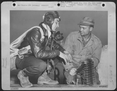 Consolidated > 2Nd Lt. Merle D. Richey Of Dayton Ohio And Rockway Park, Nj, Supervises His Armorer, Cpl. Wallace S. Barbee, Calhoun City, Ms, During Loading Of 50 Calibre Ammunition In His Republic P-47 Thunderbolt.  A Veteran Of 46 Combat Missions, Lt. Richey Destroyed